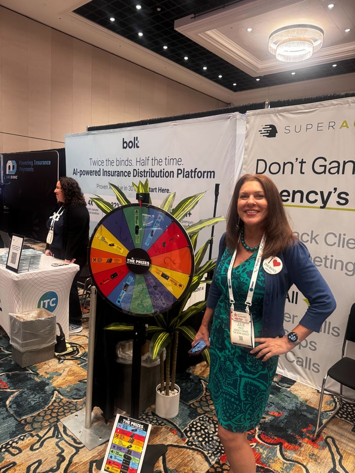 An ITC Vegas attendee with the SUPERAGENT prize wheel