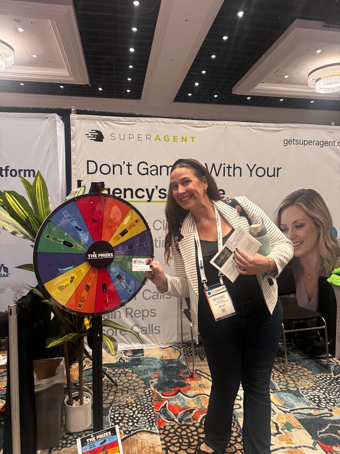 ITC Vegas attendees celebrating at the SUPERAGENT prize wheel