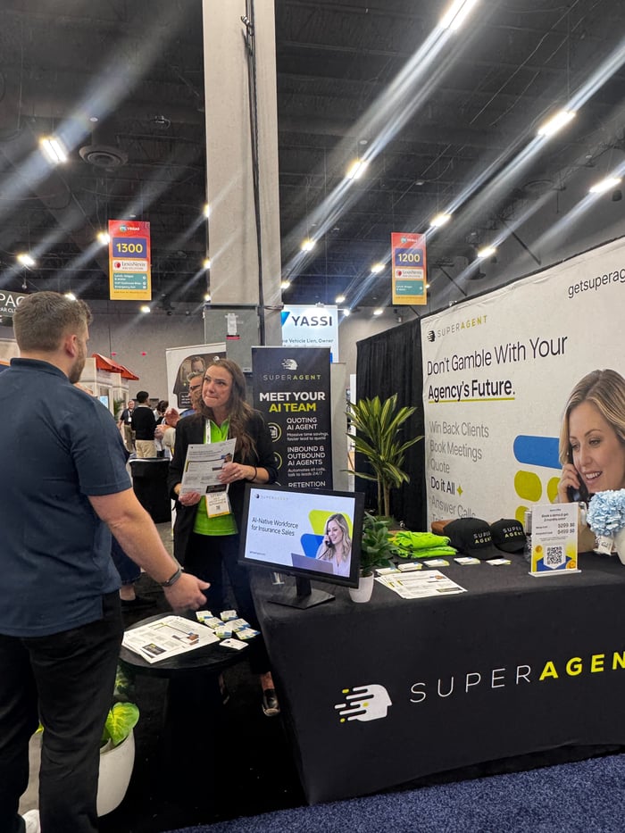 An agency leader getting a SUPERAGENT demo at the ITC Vegas booth