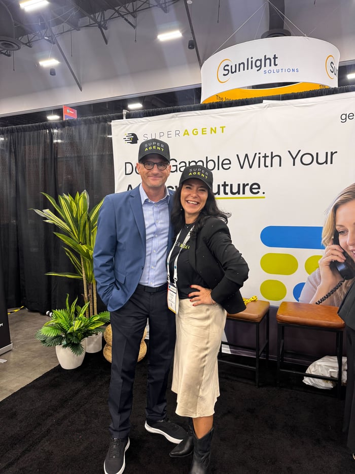 Visitors with the SUPERAGENT team at the ITC Vegas booth
