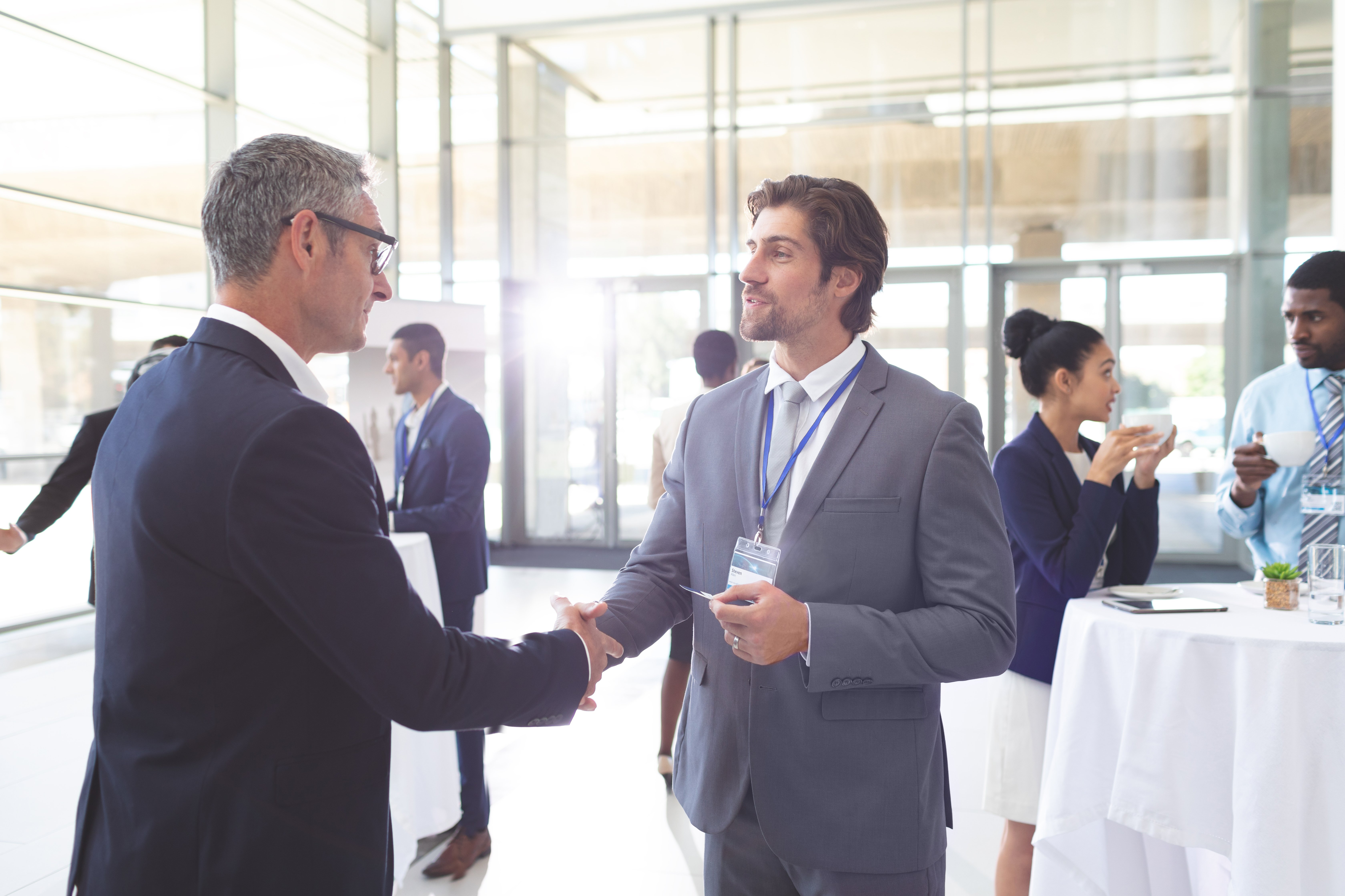 business-people-shaking-hand-during-a-seminar-div-2025-04-03-23-08-39-utc