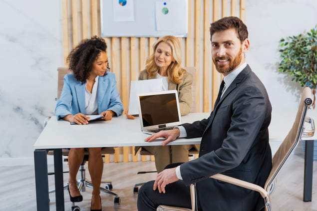 group-of-multiethnic-businesspeople-sitting-at-com-2025-03-15-19-43-52-utc